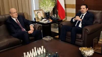 Lebanon's prime minister, Saad Hariri, right, meets the prime minister-designate, Najib Miqati, left, at Hariri's residence in Beirut.