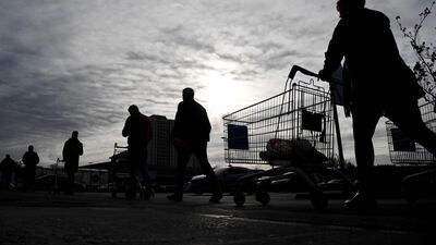 Shoppers queue to enter a Tesco supermarket in March when the pandemic first took hold. Retail analysts expect more queues to form in the run up to Christmas. Reuters