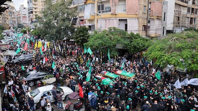 Mourners carry the coffins of Hamas officials killed on in a strike in Beirut's southern suburbs. AFP