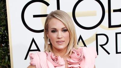 Carrie Underwood arrives for the 74th annual Golden Globe Awards ceremony. Paul Buck / EPA
