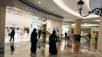 DUBAI, UNITED ARAB EMIRATES - August 4: Shoppers walk by the Harvey Nichols department store in the Mall of the Emirates in Dubai on August 4, 2008. (Randi Sokoloff / The National)