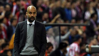 Bayern Munich manager Pep Guardiola stands during the Uefa Champions League semi-final first leg football match Club Atletico de Madrid vs Bayern Munich at the Vicente Calderon stadium in Madrid on April 27, 2016. / AFP / GERARD JULIEN