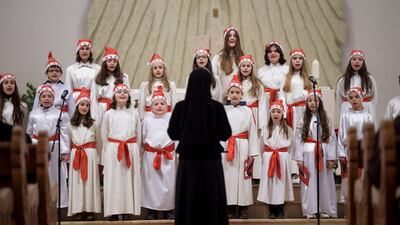 Children perform at the Mother Teresa Cathedral during the midnight Mass in Pristina, Kosovo. AFP