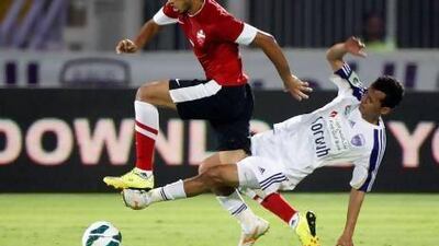 Al Ahli’s Majed Hassan is tackled by Al Ain’s Mohamed Abdulrahman. Games between the rivals last season were intense.