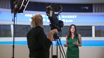 CNBC’s presenter Hadley Gamble broadcasts live for CNBC from inside Abu Dhabi Global Market. Mona Al Marzooqi / The National