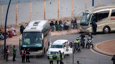 Moroccan police refuse entry to passengers at the border crossing between the Moroccan city of Fnideq and the Spanish enclave of Ceuta. Morocco suspended air and sea links with France and Spain on Friday as well as closing land borders with two Spanish North African enclaves to prevent the spread of coronavirus, officials said. AFP