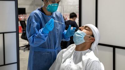 Government and semi-government workers can avail of free PCR tests by using the 'Shifaa' app. Photo: Victor Besa / The National