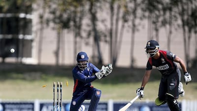 UAE batsman Shaiman Anwar is stumped by USA wicketkeeper Roy Silva on 62.