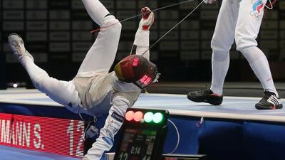 Sebastian Bachmann (L) of Germany in action with Timur Safin (R) of Russia during their Men’s Foil round of 16 match at the FEI 2014 Fencing World Championships in Kazan, Russia. Sergei Ilnitsky / EPA