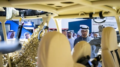 The President views an exhibit at Idex