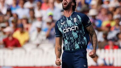 England's Reece Topley celebrates after taking the wicket of India captain Rohit Sharma for a duck. Reuters