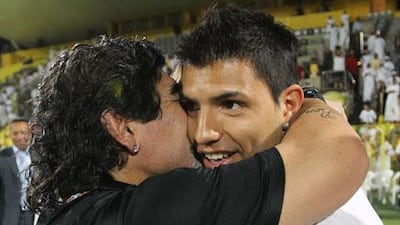 Diego Maradona hugs Sergio Aguero, the Manchester City striker, after Al Wasl beat Al Wahda in Dubai last night. Ali Haider / EPA