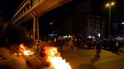 Anti-government protesters burn tires to block a main road during a protest against the power cuts, the high cost of living, the low purchasing power of the Lebanese pound, in Jal El Dib area north Beirut. EPA