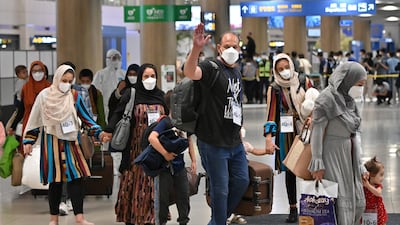 Afghan evacuees arrive at Incheon International Airport outside Seoul following their departure from Kabul via Pakistan. AFP