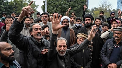 Shiite Muslims shout anti-government slogans outside a hospital following the blast. AFP