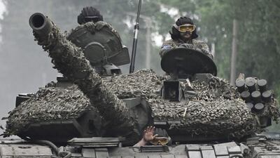 Ukrainian servicemen on a tank in the Donetsk region on June 28. AFP