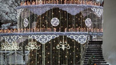 A municipal worker clears the snow-covered Cathedral Square in Vilnius, Lithuania. AP