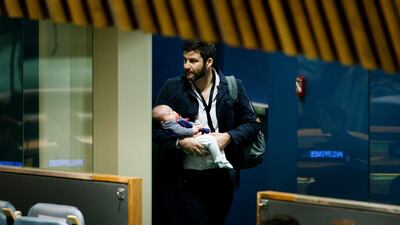 Clarke Gayford, partner of New Zealand Prime Minister Jacinda Ardern, carries their daughter Neve after listening to Ardern speak at the Nelson Mandela Peace Summit during the 73rd session of the General Assembly of the United Nations at United Nations Headquarters. EPA