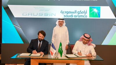 Aramco president and chief executive Amin Nasser, centre, at the signing of an agreement with French company Gaussin. Photo: Aramco