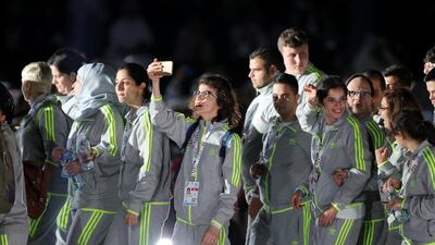 Members of the Lebanese team wave to the crowds during the opening of the Special Olympics. Chris Whiteoak / The National