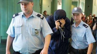 Uri Brodsky, who allegedly assisted in the murder of a Hamas official in Dubai, arrives at a Warsaw court on August 5.