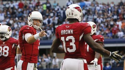 Cardinals quarterback Carson Palmer, left, acknowledges wide receiver Jaron Brown, right, after throwing a touchdown to him in their NFL win on Sunday over the Cowboys. Sue Ogrocki / AP / November 2, 2014