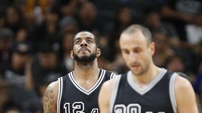 LaMarcus Aldridge of the San Antonio Spurs checks the score against the Golden State Warriors at AT&T Center on April 10, 2016 in San Antonio, Texas. The Warriors won 92-86, tying the all-time record for wins in a season with 72. Ronald Cortes/Getty Images/AFP