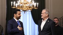 Iraqi Prime Minister Ali Al Zaidi, left, and Iranian President Masoud Pezeshkian sign co-operation agreements in Tehran. Iranian Presidential Office / EPA