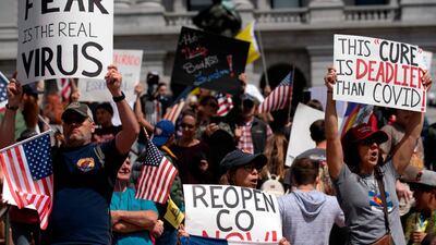 Demonstrators gather in front of the Colorado State Capitol building to protest coronavirus stay-at-home orders during a "ReOpen Colorado" rally in Denver, Colorado. AFP