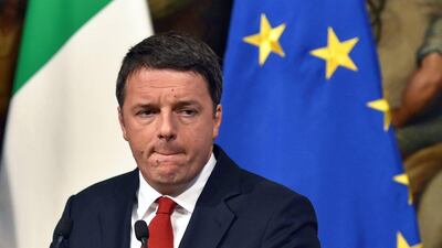 Italian prime minister Matteo Renzi reacts during a joint press conference with the Italian minister of economy and finance at Palazzo Chigi in Rome on November 28, 2016. Andreas Solaro/AFP