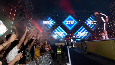 Fans wave to R3wire as he performs. AP Photo