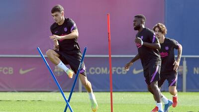 Barcelona midfielder Pedri jumping during training. AFP