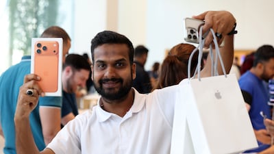 Shafeeq Malabar picks up the iPhone 17 and iPhone Air from the Apple store in Dubai Mall. All photos: Chris Whiteoak / The National