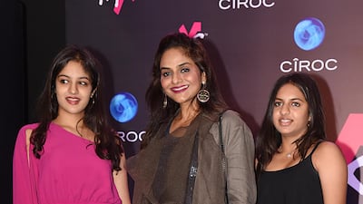 Forgotten face: Madhoo Shah, centre, with her daughters. AFP