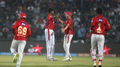 Kings XI Punjab bowler Ankit Rajpoot, second left, was named man of the match against Delhi Daredevils. Manish Swarup / AP Photo