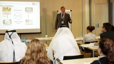 Emirati and expat legal trainees listen to a lecture at Dubai International Financial Centre Courts’ academy. DIFC and Abu Dhabi Global Markets allow lawyers of all nationalities to practice, while the domestic courts restrict formal hearings to UAE nationals