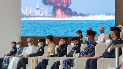 Police and military officers observe a mock attack on a port facility. Photo: SPA