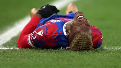 Wilfried Zaha of Crystal Palace goes down with an injury. Getty