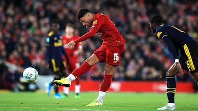 Liverpool's Alex Oxlade-Chamberlain scores his side's third goal. PA