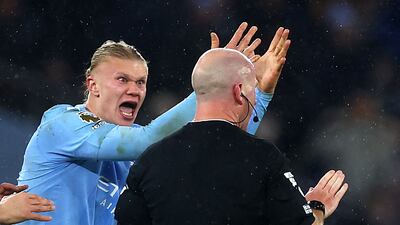 Manchester City's Erling Haaland remonstrates with Simon Hooper after the referee's controversial late call against Tottenham Hotspur. Reuters