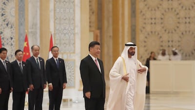 Chinese President Xi Jinping and Sheikh Mohamed bin Zayed arrive at the Presidential Palace in Abu Dhabi in July 2018. AFP