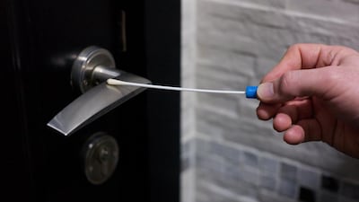 The National's news editor Michael Jabri-Pickett collects swab samples from around the newsroom. (Brian Kerrigan / The National)