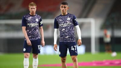 Manchester City's Phil Foden and Kevin De Bruyne during the warm up before the match against Wolves at Molineux. Reuters