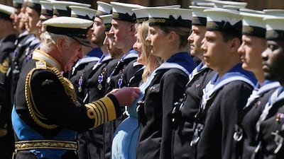 King Charles III presents the Royal Victorian Order to members of the Royal Navy on May 30. AP
