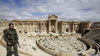 This photo from March 14, 2014 show a Syrian policeman patrolling the ancient city of Palmyra. Joseph Eid/AFP Photo