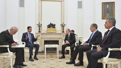 Mr Al Assad, second left, meeting Mr Putin, third right and Russian foreign minister Sergei Lavrov. Alexei Druzhinin / RIA Novosti Kremlin / Reuters