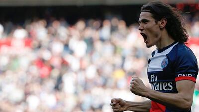 Paris Saint-Germain forward Edinson Cavani reacts after opening the scoring during the Ligue 1 match against Reims at the Parc des Princes on Saturday. Thomas Samson / AFP / April 5, 2014