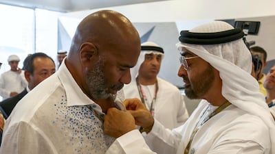 Sheikh Mohamed bin Zayed, Crown Prince of Abu Dhabi and Deputy Supreme Commander of the UAE Armed Forces (R), speaks with Steve Harvey (L), at the Paddock Club on the final day of the 2018 Formula 1 Etihad Airways Abu Dhabi Grand Prix, at Yas Marina Circuit. Hamad Al Kaabi / Ministry of Presidential Affairs