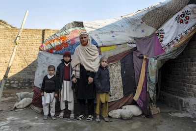 Tawas Khan and his children with their makeshift tent. Lynzy Billing for The National