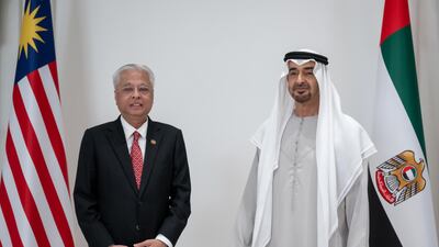 President Sheikh Mohamed and Mr Ismail stand for a photograph.